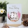 Geburtstagskarte mit zwei Katzen und Blumen. Überschrift Happy Birthday